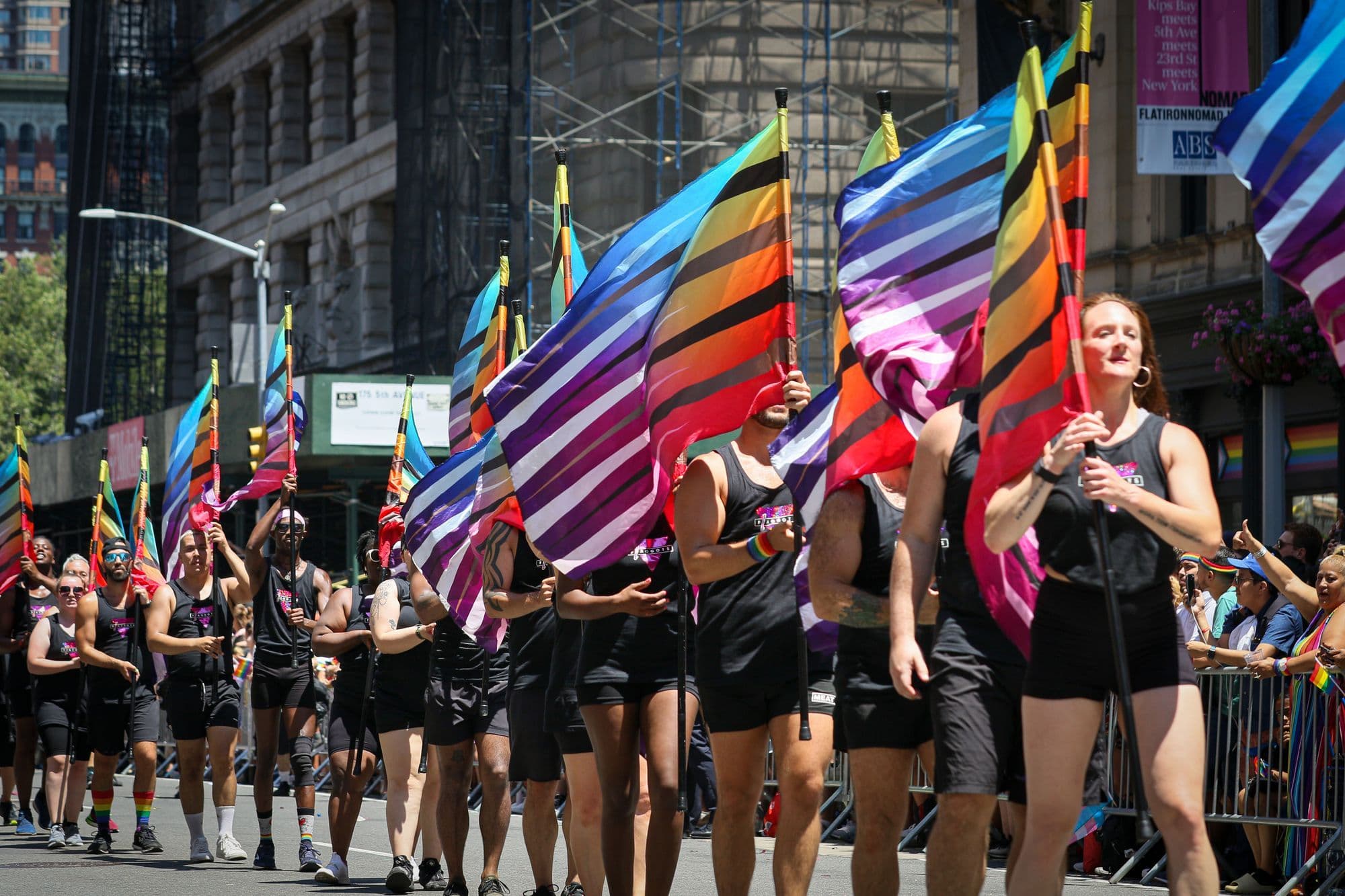 Marchers carry rainbow flags during a New York City Pride parade.